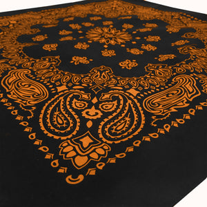 Black bandana with orange print angle view