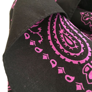 close up view of black and pink bandana hemmed edge