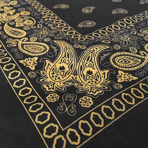 Black and yellow floral paisley bandana angle view